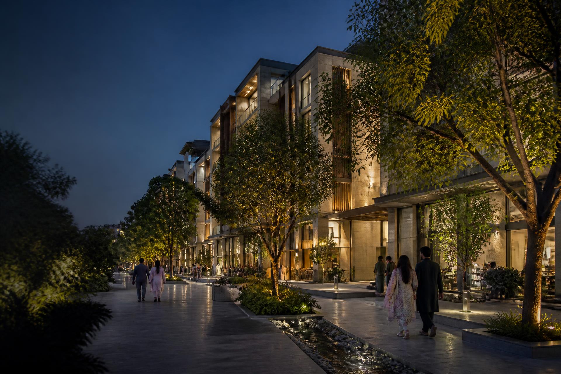 Contemporary landscaped residential development in Lahore at blue hour with residents walking